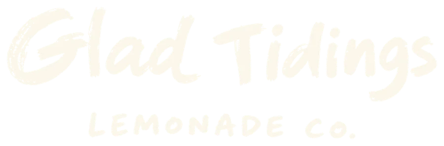 Cream Glad Tidings logo on green